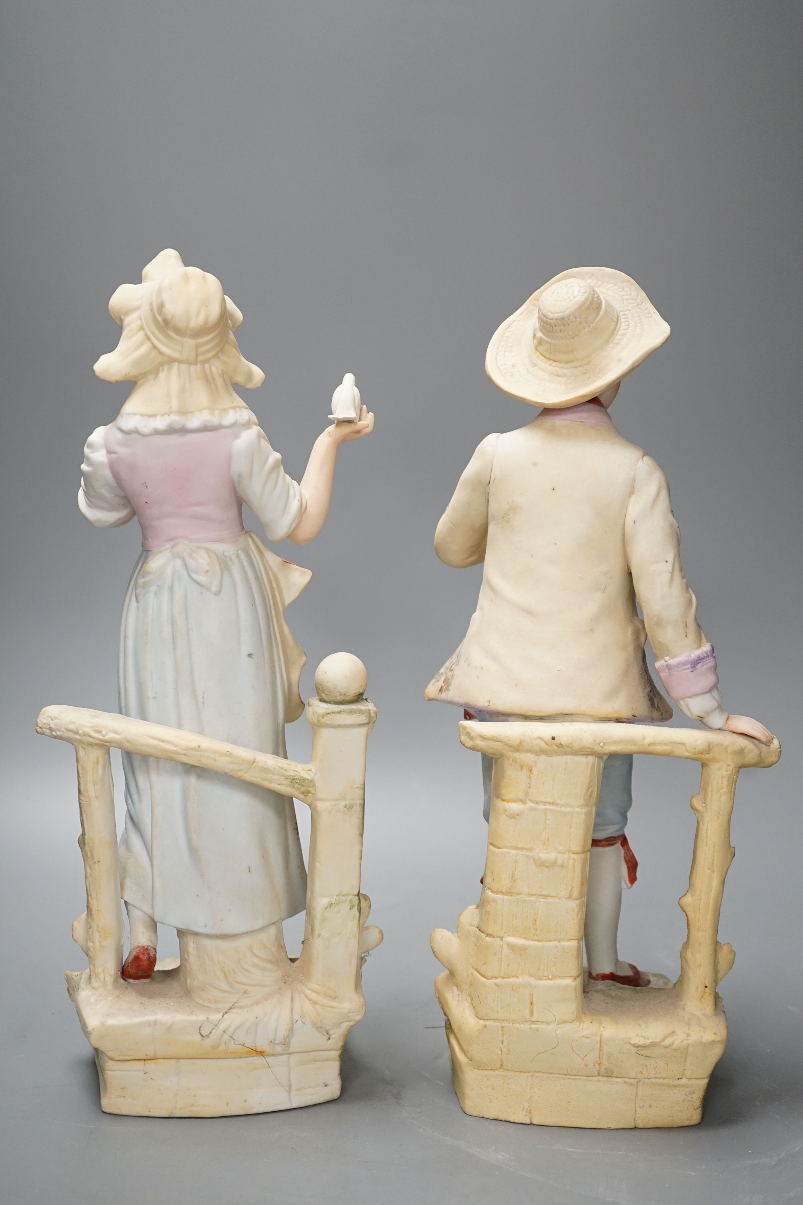 A pair of bisque figures - 34.5cm